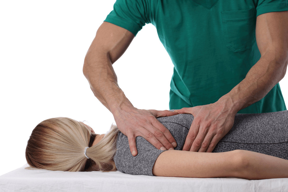 Chiropractor adjusting patient