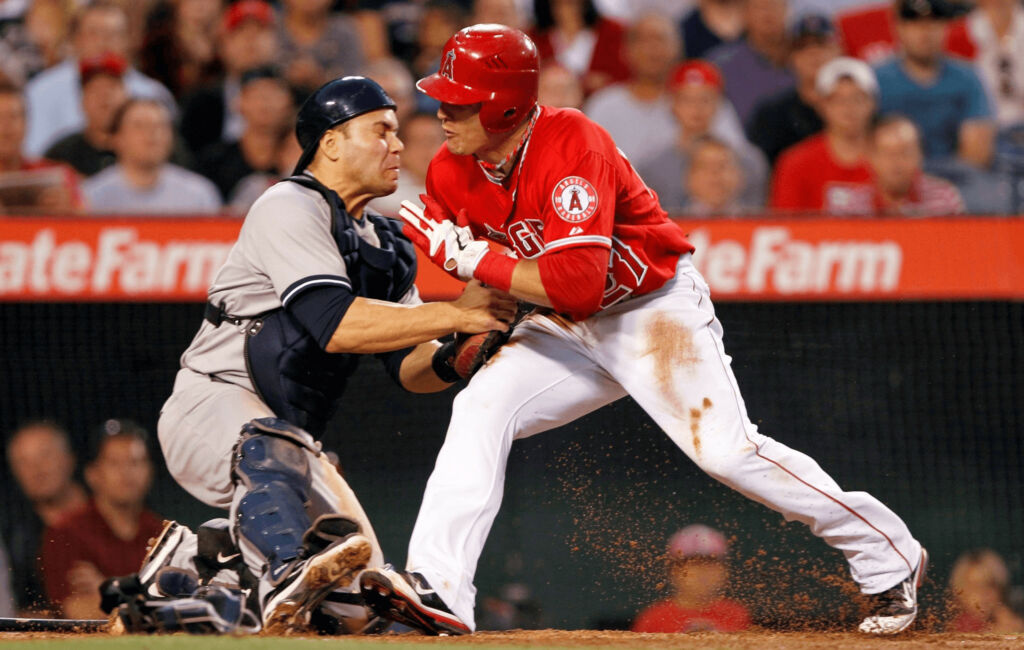 Baseball play running into catcher