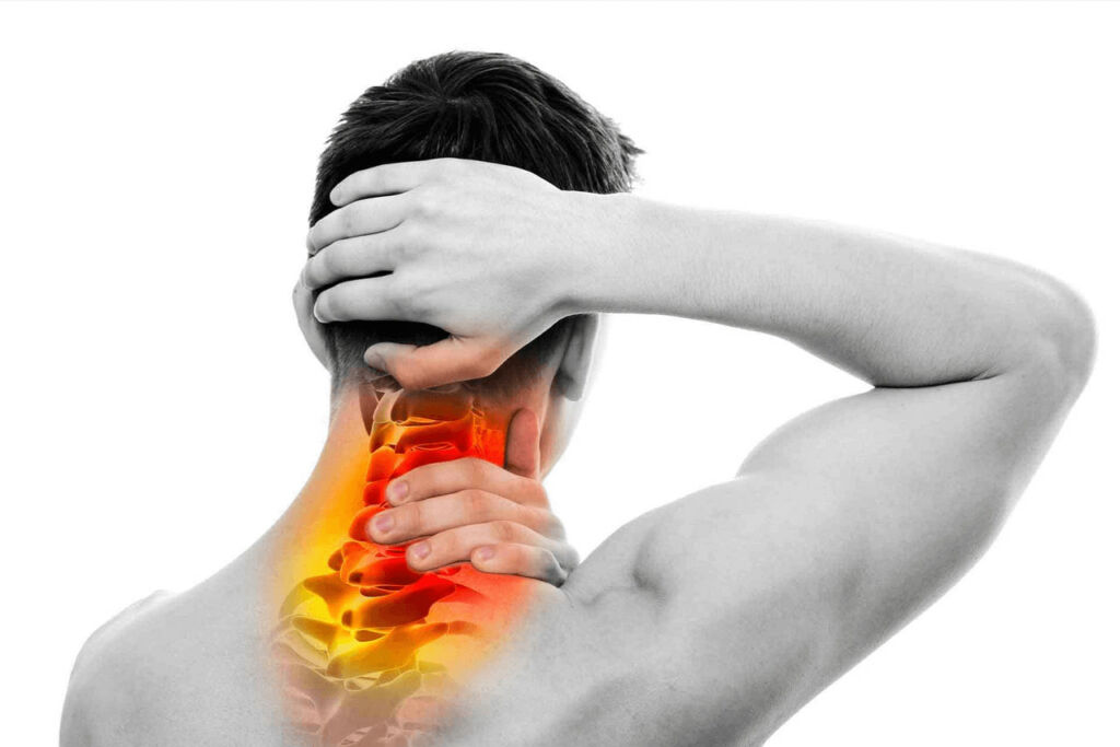 Man holding the back of his neck in pain