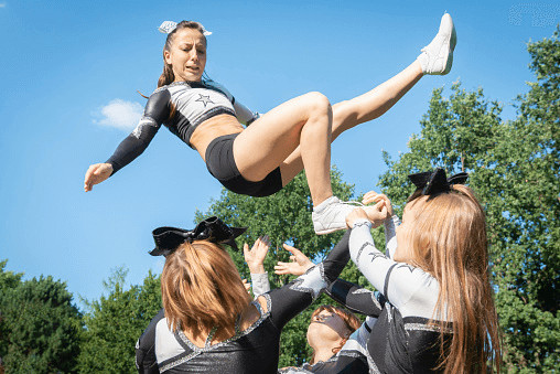 Cheerleader being dropped by team